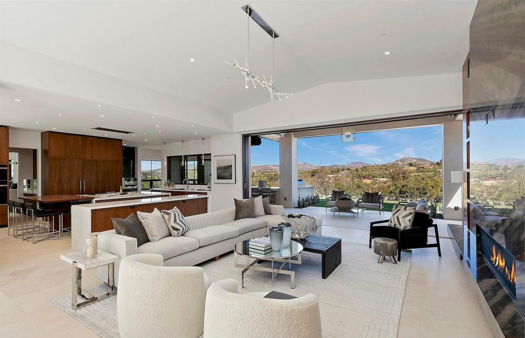 The Home in Rancho Santa Fe is an exquisite luxury oasis conceived by top team builder & design visionaries offering incomparable unobstructed views now available for sale. This house located at 18080 Via De Fortuna, Rancho Santa Fe, California