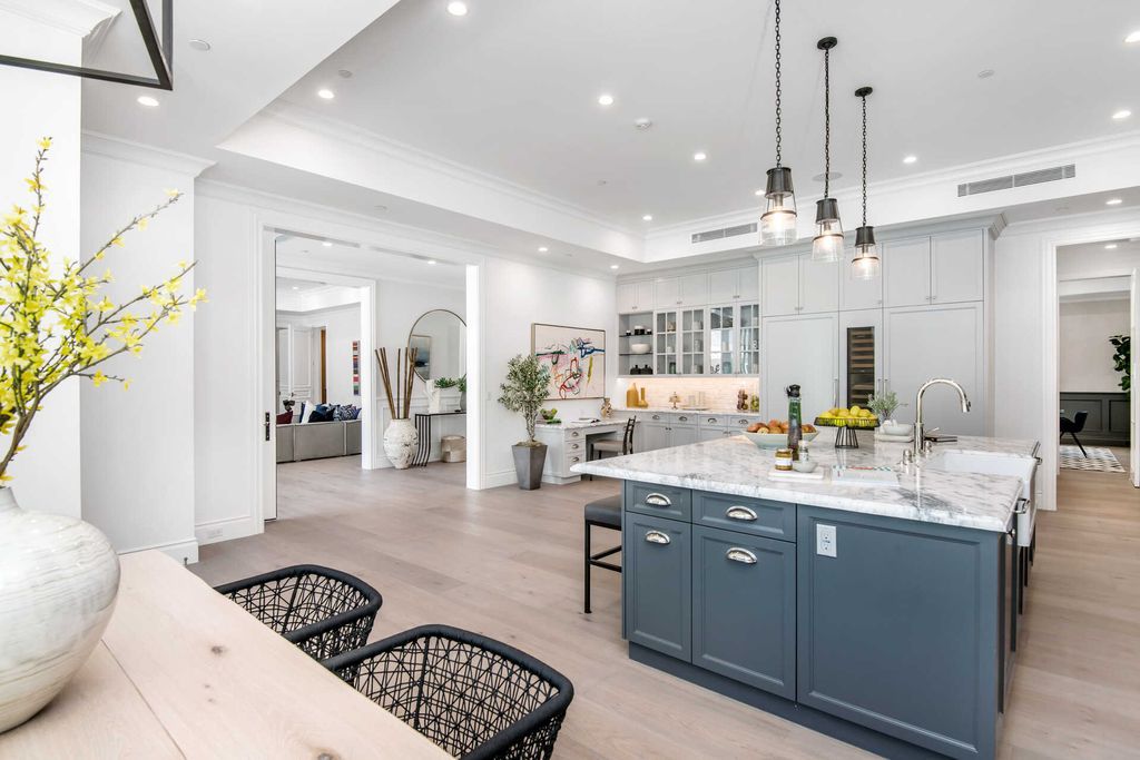 The Home in Encino is an exquisite new construction estate with a spacious great room, a home theater with 12 automatic chairs and more now available for sale. This home located at 4509 Noeline Ave, Encino, California