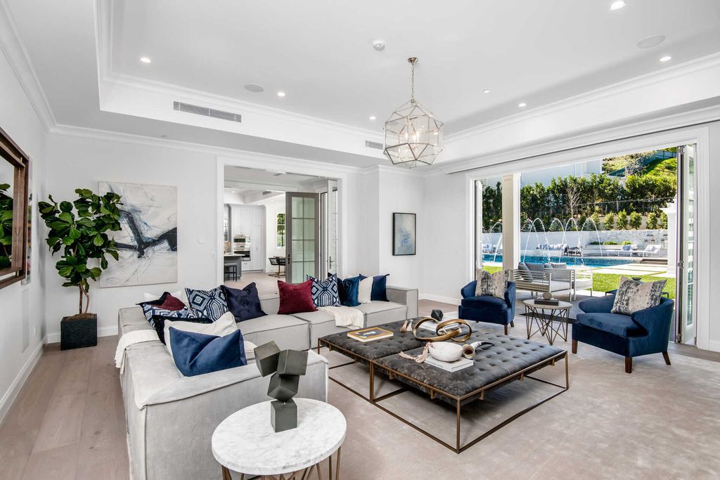 The Home in Encino is an exquisite new construction estate with a spacious great room, a home theater with 12 automatic chairs and more now available for sale. This home located at 4509 Noeline Ave, Encino, California