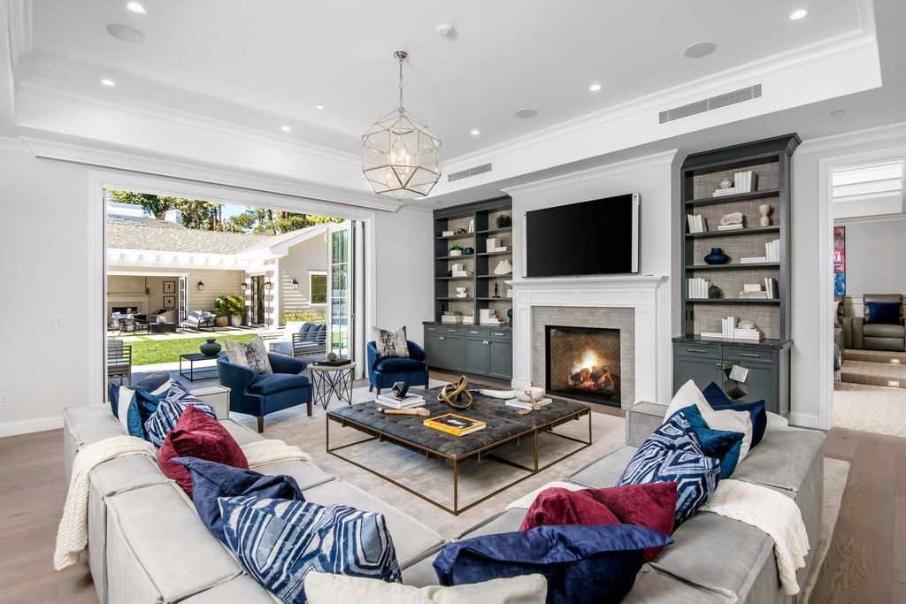 The Home in Encino is an exquisite new construction estate with a spacious great room, a home theater with 12 automatic chairs and more now available for sale. This home located at 4509 Noeline Ave, Encino, California