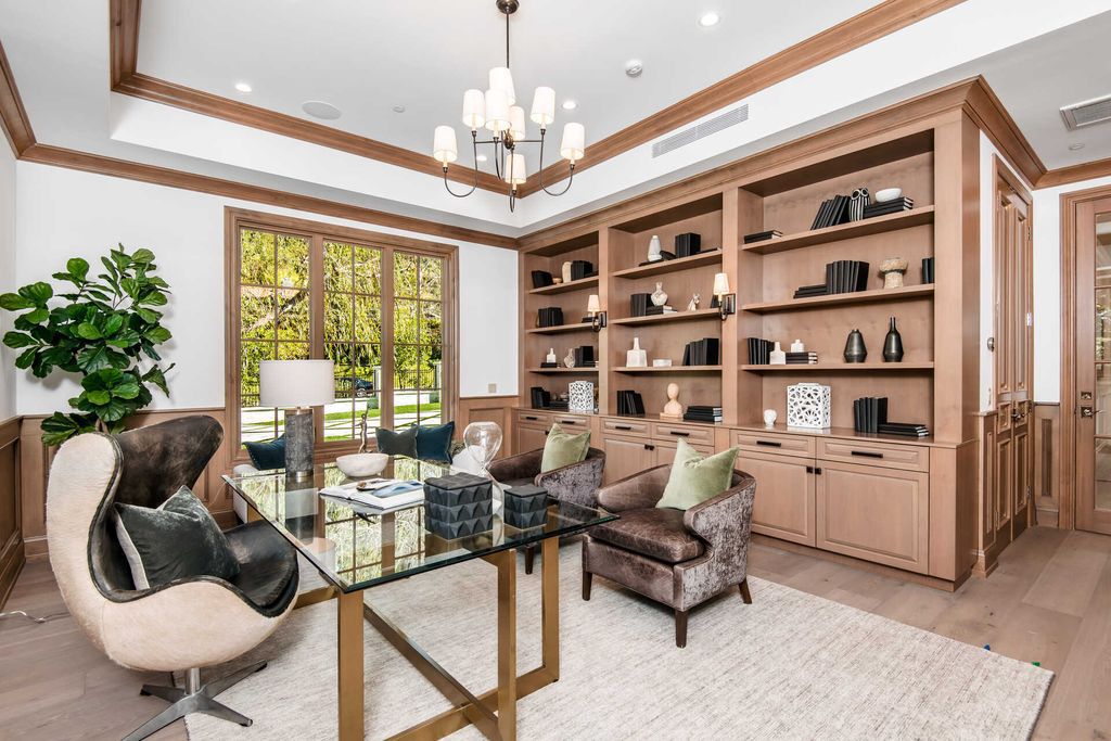 The Home in Encino is an exquisite new construction estate with a spacious great room, a home theater with 12 automatic chairs and more now available for sale. This home located at 4509 Noeline Ave, Encino, California