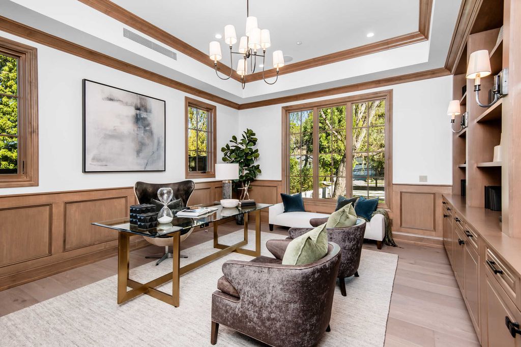 The Home in Encino is an exquisite new construction estate with a spacious great room, a home theater with 12 automatic chairs and more now available for sale. This home located at 4509 Noeline Ave, Encino, California