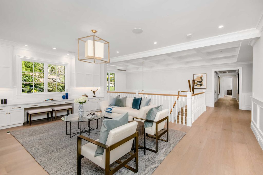 The Home in Encino is an exquisite new construction estate with a spacious great room, a home theater with 12 automatic chairs and more now available for sale. This home located at 4509 Noeline Ave, Encino, California