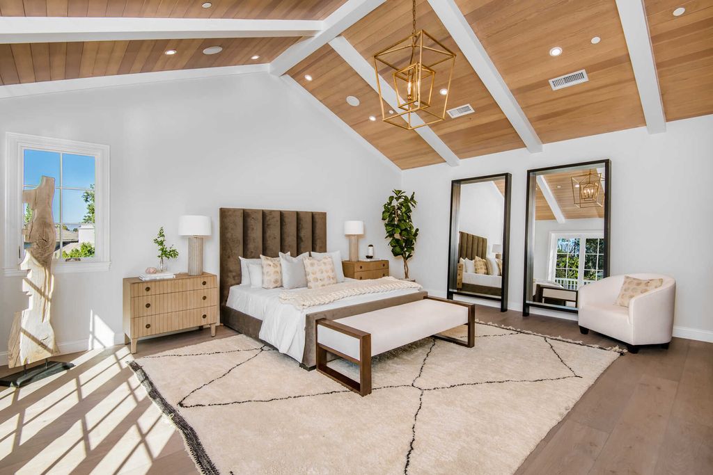 The Home in Encino is an exquisite new construction estate with a spacious great room, a home theater with 12 automatic chairs and more now available for sale. This home located at 4509 Noeline Ave, Encino, California