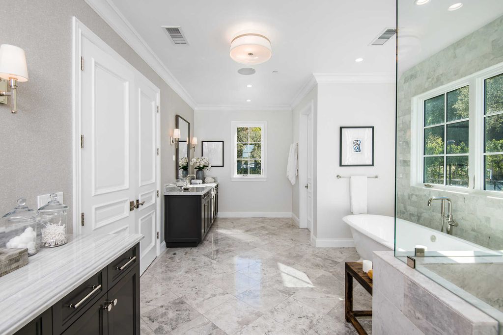 The Home in Encino is an exquisite new construction estate with a spacious great room, a home theater with 12 automatic chairs and more now available for sale. This home located at 4509 Noeline Ave, Encino, California