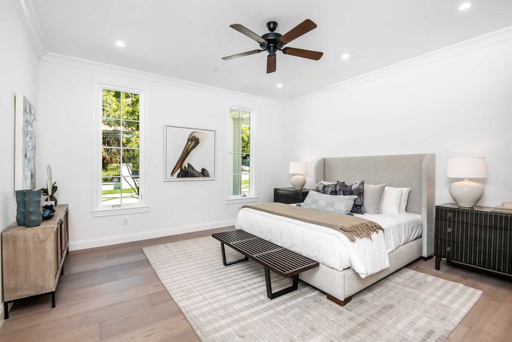 The Home in Encino is an exquisite new construction estate with a spacious great room, a home theater with 12 automatic chairs and more now available for sale. This home located at 4509 Noeline Ave, Encino, California