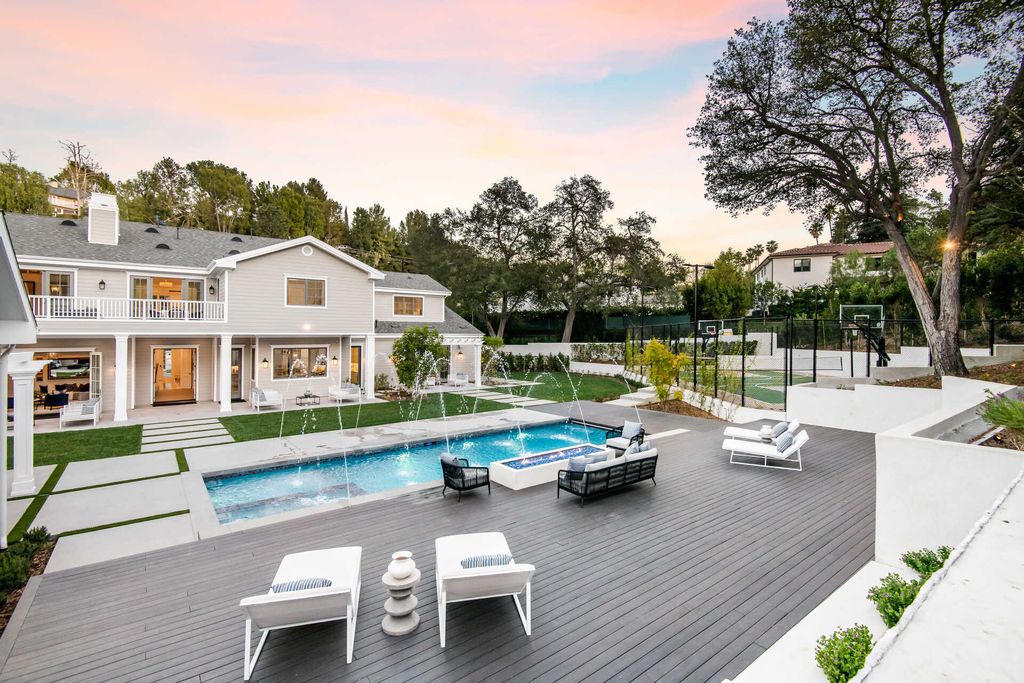 The Home in Encino is an exquisite new construction estate with a spacious great room, a home theater with 12 automatic chairs and more now available for sale. This home located at 4509 Noeline Ave, Encino, California