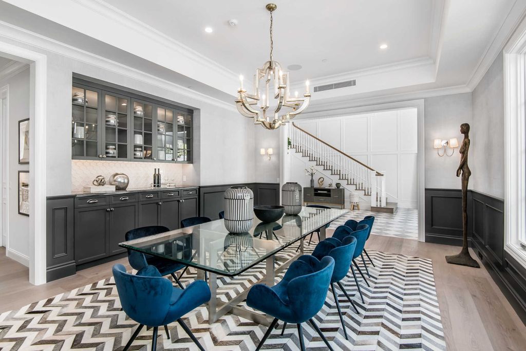 The Home in Encino is an exquisite new construction estate with a spacious great room, a home theater with 12 automatic chairs and more now available for sale. This home located at 4509 Noeline Ave, Encino, California