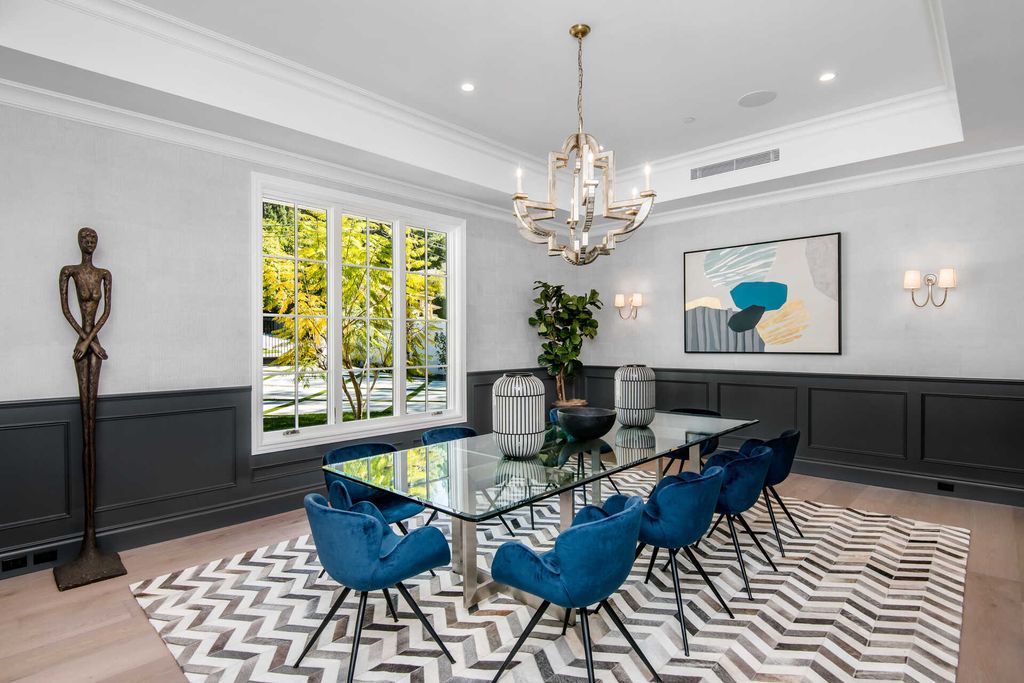 The Home in Encino is an exquisite new construction estate with a spacious great room, a home theater with 12 automatic chairs and more now available for sale. This home located at 4509 Noeline Ave, Encino, California