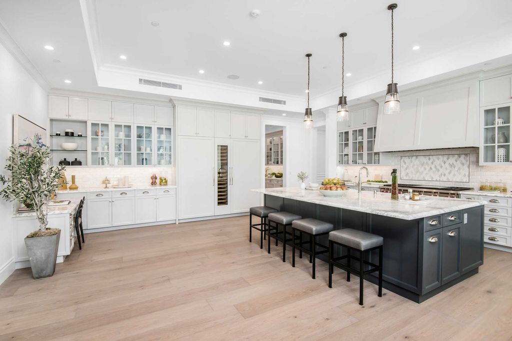 The Home in Encino is an exquisite new construction estate with a spacious great room, a home theater with 12 automatic chairs and more now available for sale. This home located at 4509 Noeline Ave, Encino, California