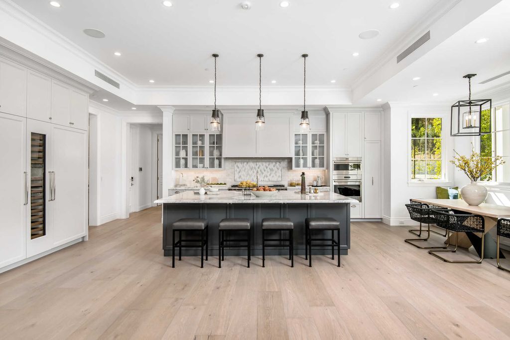 The Home in Encino is an exquisite new construction estate with a spacious great room, a home theater with 12 automatic chairs and more now available for sale. This home located at 4509 Noeline Ave, Encino, California