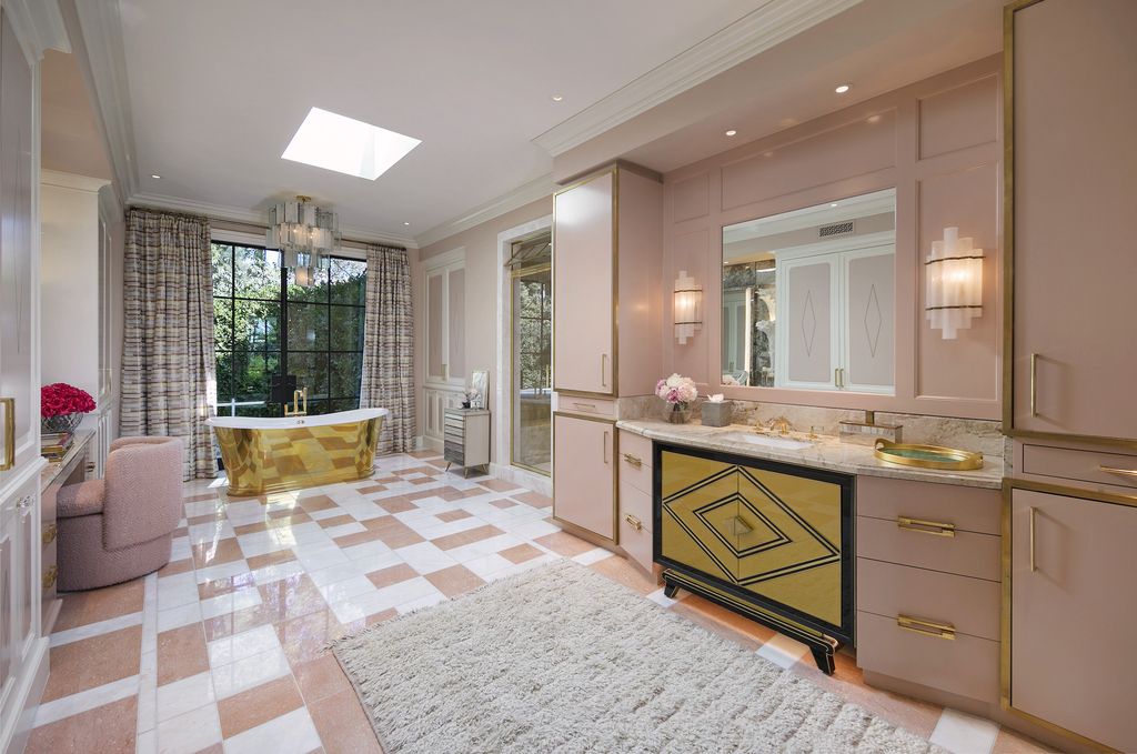 The Mansion in Bel Air is a showplace for art and high design offering privacy and stunning views of golf course and city beyond now available for sale. This home located at 10771 Bellagio Rd, Los Angeles, California