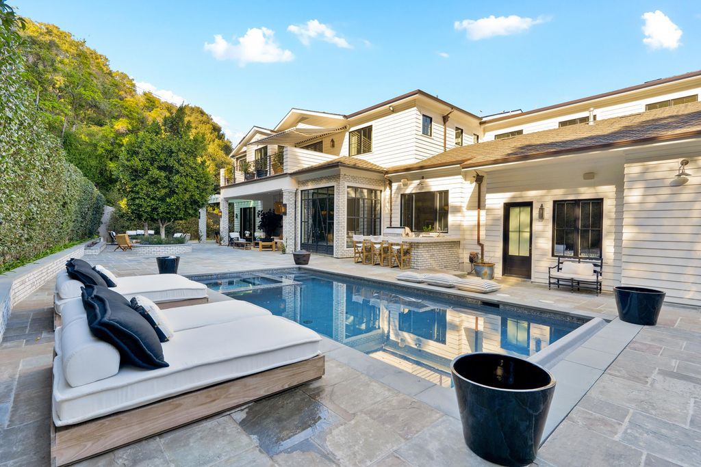 The Farmhouse in Los Angeles is a newer construction luxury gated estate boasts quality craftsmanship and timeless on point design now available for sale. This home located at 2333 Mandeville Canyon Rd, Los Angeles, California
