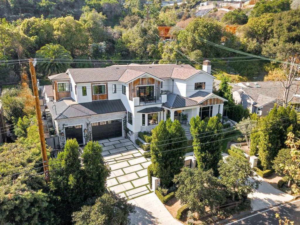 The Farmhouse in Los Angeles is a newer construction luxury gated estate boasts quality craftsmanship and timeless on point design now available for sale. This home located at 2333 Mandeville Canyon Rd, Los Angeles, California