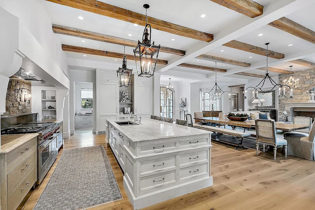 To achieve a cozy and inviting atmosphere in your kitchen, consider distressed grey cabinets. This rustic style adds character and charm to the space. Opt for cabinets with a weathered finish, showcasing the natural wood grain underneath the grey paint. Pair them with vintage-inspired hardware and a farmhouse sink to enhance the rustic appeal. Balance the look with modern elements like subway tile backsplash and sleek black appliances for a transitional twist.