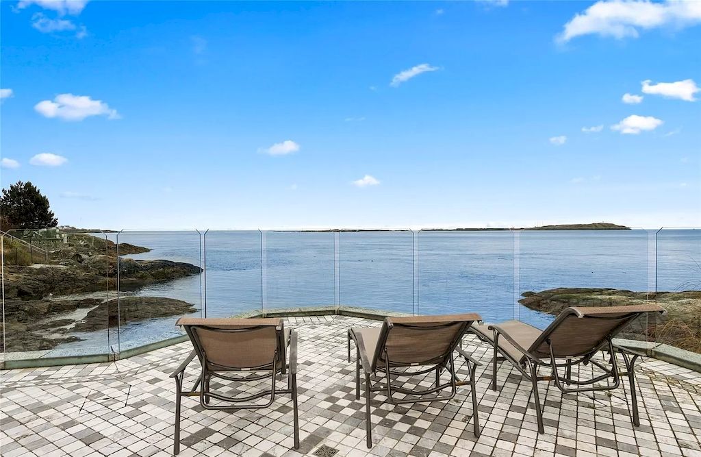 The House in Oak Bay is entertainment haven complete with resort style living with a pool, hot tub, expansive patio sections including covered sections & oceanfront setting with beach access now available for sale