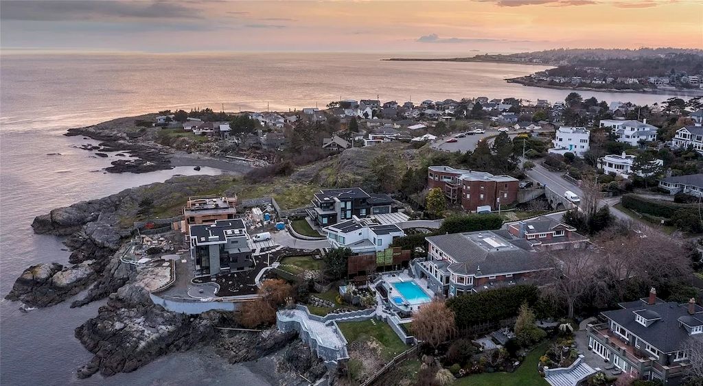 The House in Oak Bay is entertainment haven complete with resort style living with a pool, hot tub, expansive patio sections including covered sections & oceanfront setting with beach access now available for sale