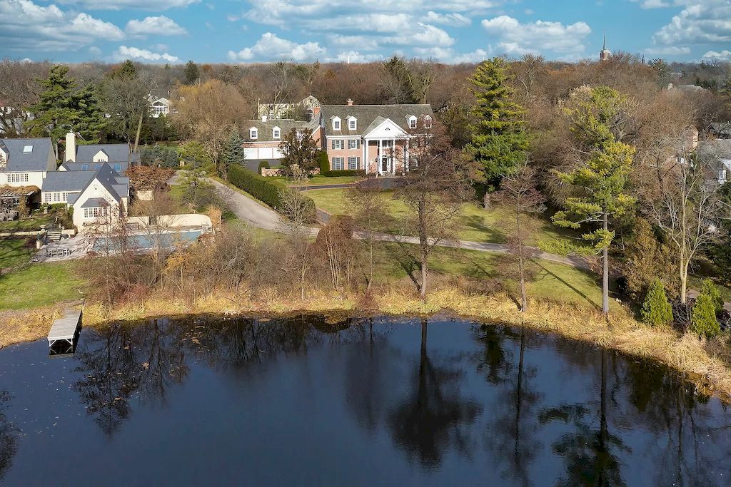 The Home in Illinois is a luxurious home built in 2005 with exquisite millwork, spacious rooms and high ceilings now available for sale. This home located at 27 Indian Hill Rd, Winnetka, Illinois; offering 06 bedrooms and 08 bathrooms with 8,800 square feet of living spaces. 