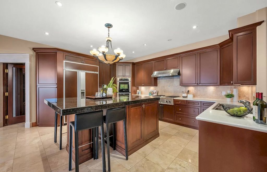 The Villa in West Vancouver offers a main level including gourmet kitchen, wine cellar, open space to the patio with hand painted tiles, interior swimming pool, hot tub now available for sale