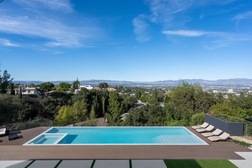 The Home in Sherman Oaks is a recently built modern masterpiece with unobstructed views of the city and mountains now available for sale. This home located at 3369 Alana Dr, Sherman Oaks, California;