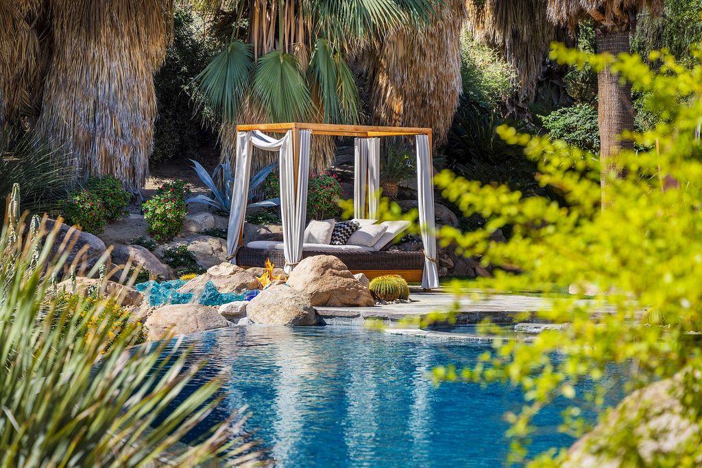 The Home in Palm Desert is One-of-a-kind estate has an unequalled outdoor living with two fireplaces and infinity-edge pool now available for sale. This home located at 964 Andreas Canyon Dr, Palm Desert, California