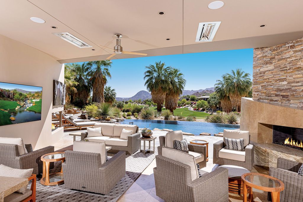 The living room is designed adjacent to the outside swimming pool and the desert landscape is undeniable. The living room space is designed to be open to the outside swimming pool, creating a feeling of absolute ventilation. Beige tones are used to make the overall living room even more spacious. Such a smart way to bring the unequaled outdoor living into your living room.