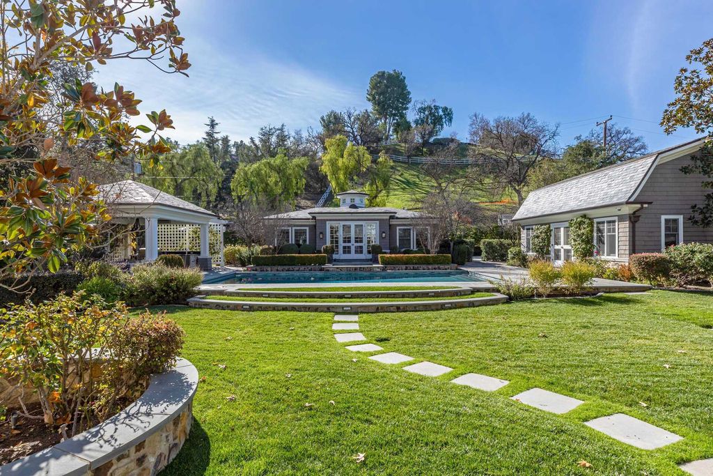 The Home in Hidden Hills is a stunning Dutch Colonial with outdoor kitchen make for the ultimate in estate living now available for sale. This home located at 23870 Long Valley Rd, Hidden Hills, California;