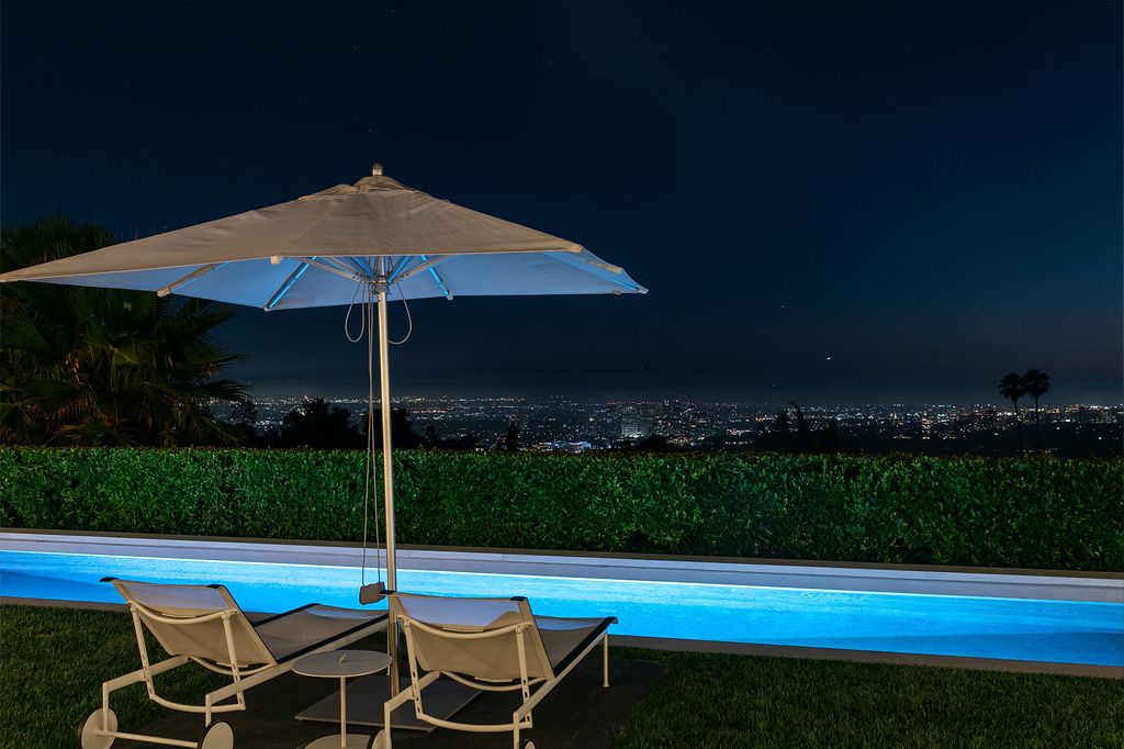The Beverly Hills Home is a true sanctuary on one of the most exclusive streets in Trousdale featuring expansive views, total privacy, and specialist finishes now available for sale. This home located at 545 Chalette Dr, Beverly Hills, California