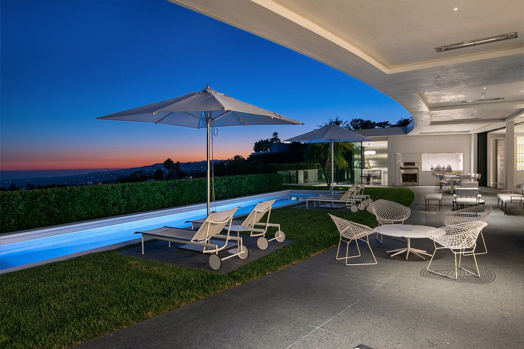 The Beverly Hills Home is a true sanctuary on one of the most exclusive streets in Trousdale featuring expansive views, total privacy, and specialist finishes now available for sale. This home located at 545 Chalette Dr, Beverly Hills, California