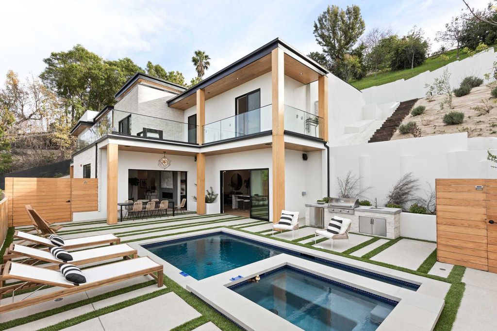 The Home in Studio City is a gated contemporary masterpiece offers sophisticated design and magnificent valley views now available for sale. This home located at 11258 Laurie Dr, Studio City, California