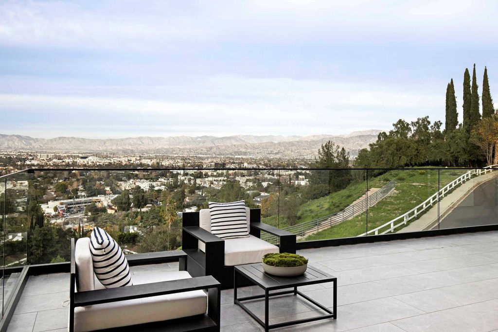 The Home in Studio City is a gated contemporary masterpiece offers sophisticated design and magnificent valley views now available for sale. This home located at 11258 Laurie Dr, Studio City, California