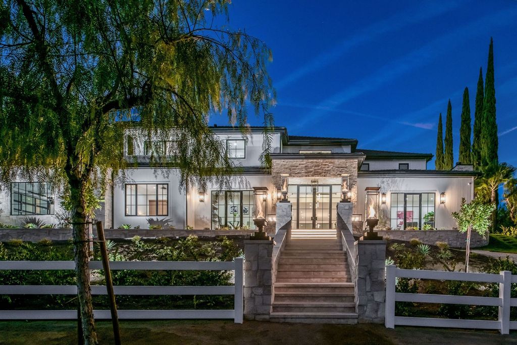 The Hidden Hills Home is a newly constructed modern estate overlooking pastoral hillside and natural state park land now available for sale. This home located at 24961 Kit Carson Rd, Hidden Hills, California