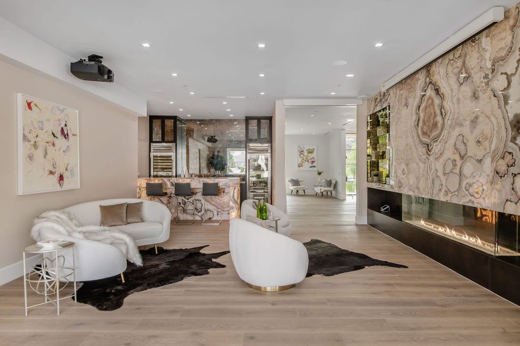 The Hidden Hills Home is a newly constructed modern estate overlooking pastoral hillside and natural state park land now available for sale. This home located at 24961 Kit Carson Rd, Hidden Hills, California