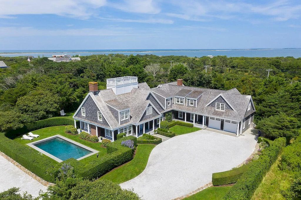 The Home in Massachusetts is a luxurious home concealed by mature and thoughtfully designed gardens now available for sale. This home located at 1 Shawkemo Hills Ln, Nantucket, MA 02554, Massachusetts; offering 06 bedrooms and 09 bathrooms with 8,139 square feet of living spaces.