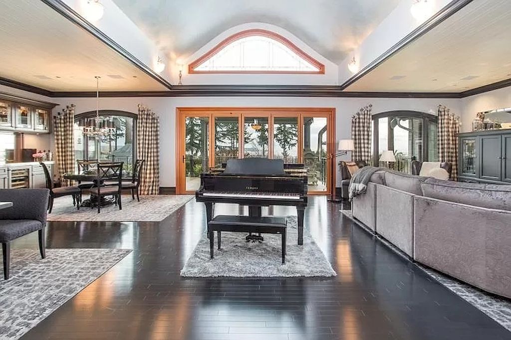 The Home in Surrey offers plenty of entertaining space with views over the expansive decks, pool, infinity hot tub, fire pit and tennis court now available for sale