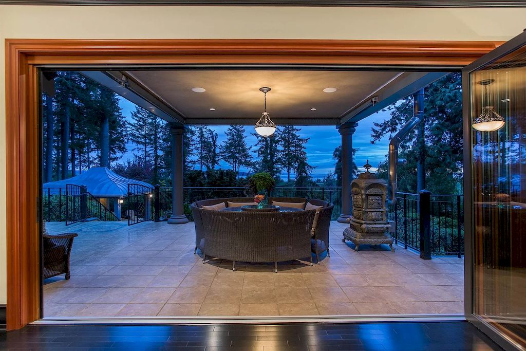 The Home in Surrey offers plenty of entertaining space with views over the expansive decks, pool, infinity hot tub, fire pit and tennis court now available for sale