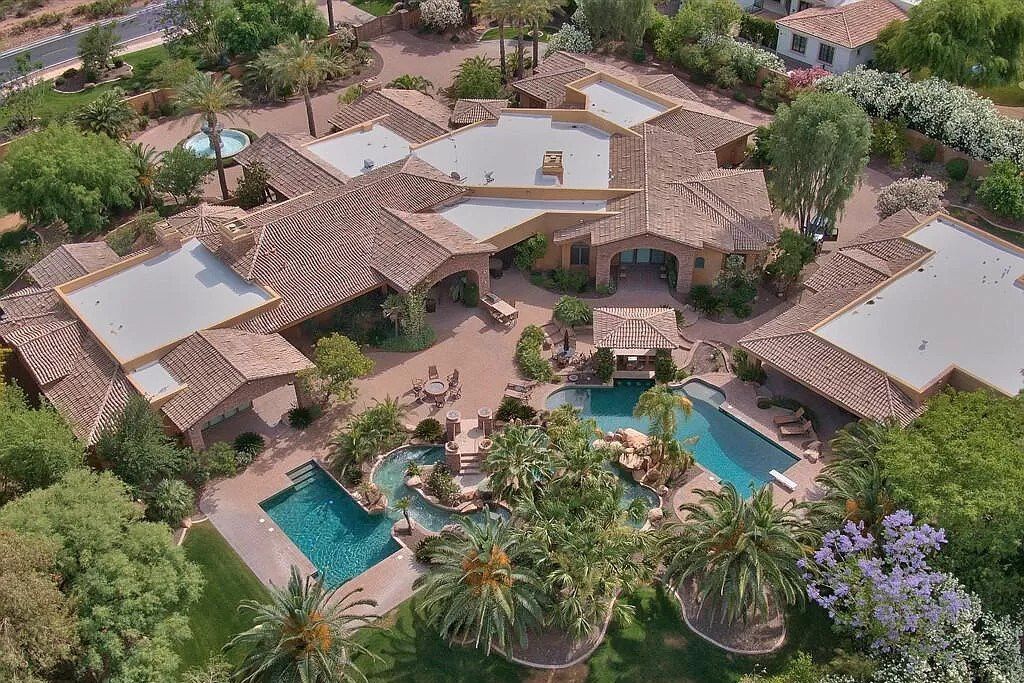 This $9,500,000 Home in Arizona offers a magnificent mixture of grass and desert landscaping