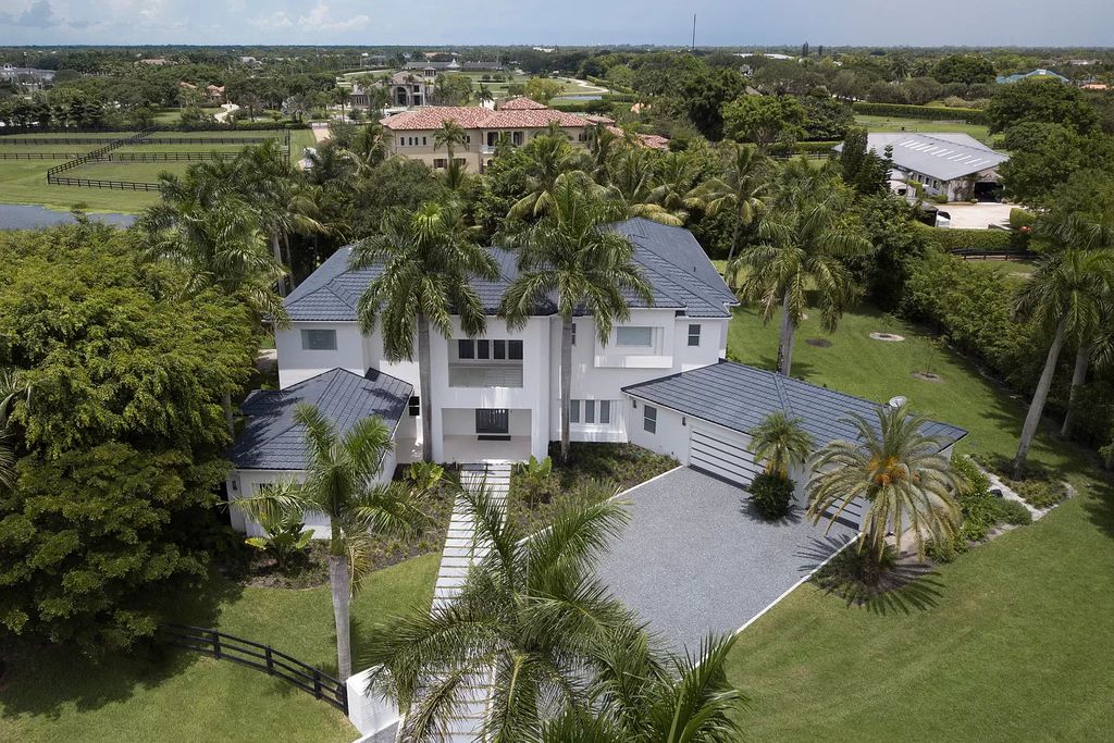 The Home in Wellington is an incredible contemporary estate in the prestigious community of Southfields now available for sale. This home located at 3580 Aiken Ct, Wellington, Florida