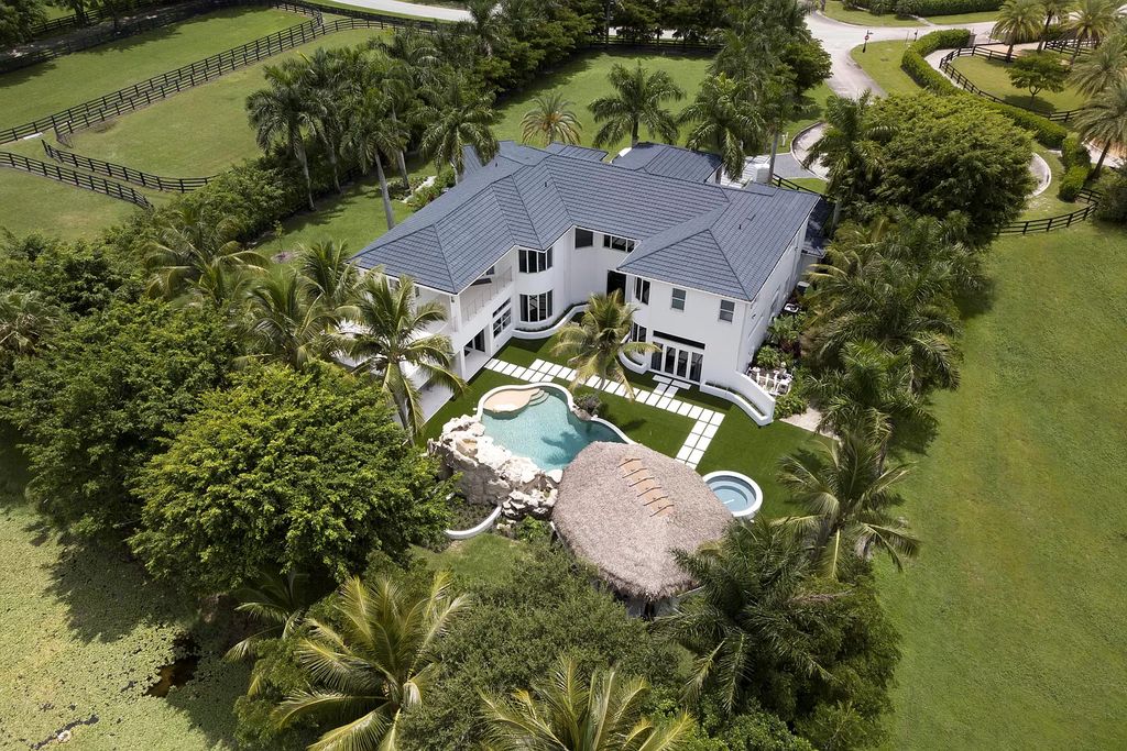 The Home in Wellington is an incredible contemporary estate in the prestigious community of Southfields now available for sale. This home located at 3580 Aiken Ct, Wellington, Florida