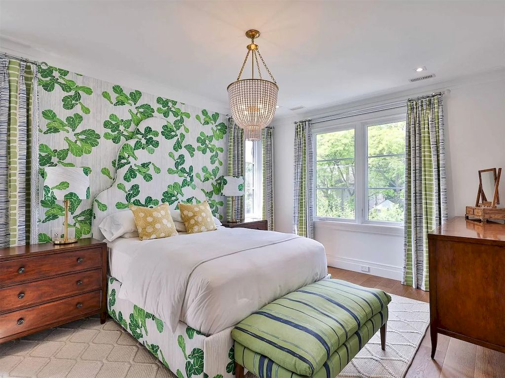 No green bedroom would be complete without a tropical design idea. A tropical mural, plant-print headboards, and ceiling fans or chandeliers will work well to create a tropical holiday vibe (Whether you're on holiday or not). Supplement some wooden elements, wardrobe doors, and rattan furniture to enrich the idea.