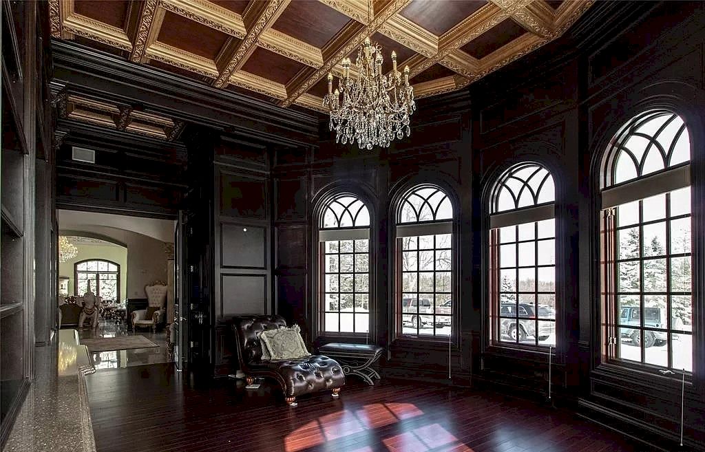 Some combinations are timeless. Black and gold, cookies and milk, and peanut butter and jelly. This living room's color scheme is dark and opulent. Interior design is made stylish, dramatic, and edgy by the use of black and gold. Keep in mind that you should exercise some discipline while utilizing gold. Take some ideas from this picture. In contrast to the dark walls, the elaborate, golden chandelier and ceiling stand out even more. The remaining decorations stick to a black or white color scheme, maintaining the room's elegant and refined appearance. 