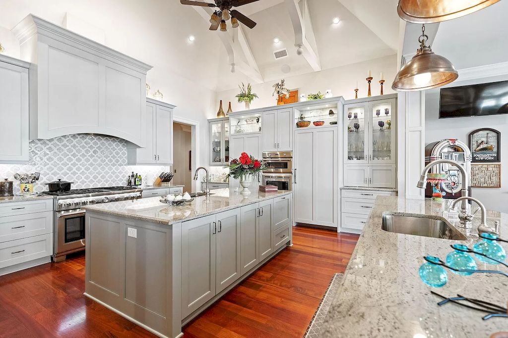 For a timeless look, consider soft grey cabinets with intricate details and elegant hardware. This style complements traditional and vintage-inspired kitchen designs. The soft grey color adds a touch of sophistication and elegance, while the intricate details on the cabinets bring a sense of craftsmanship and charm. Pair the cabinets with marble countertops and antique-inspired light fixtures to complete the classic look. Embrace the charm of the past!