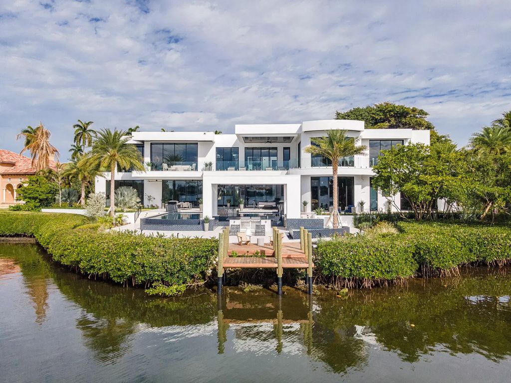 The Lake Worth Waterfront Mansion is a architectural marvel in the heart of Manalapan has an incredible infinity-edge pool now available for sale. This home located at 110 Churchill Way, Lake Worth, Florida