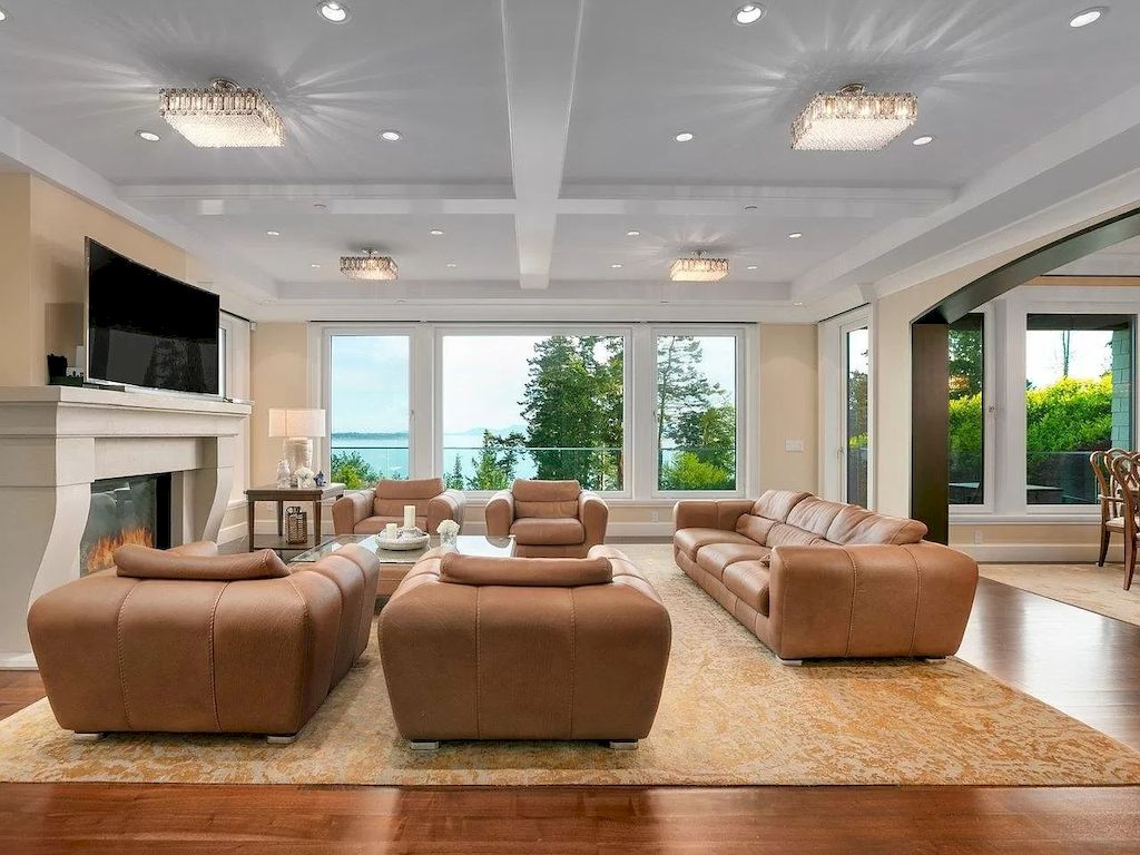 To avoid the light brown sofa looking out of place while still retaining its distinct personality, repeat its color elsewhere in the room. A set of brown and beige couches is used in this room. The light beige carpet and the paint color on the walls tie the look of the objects together. The light brown leather couch's soft material accents and relaxing silhouette continue the theme.