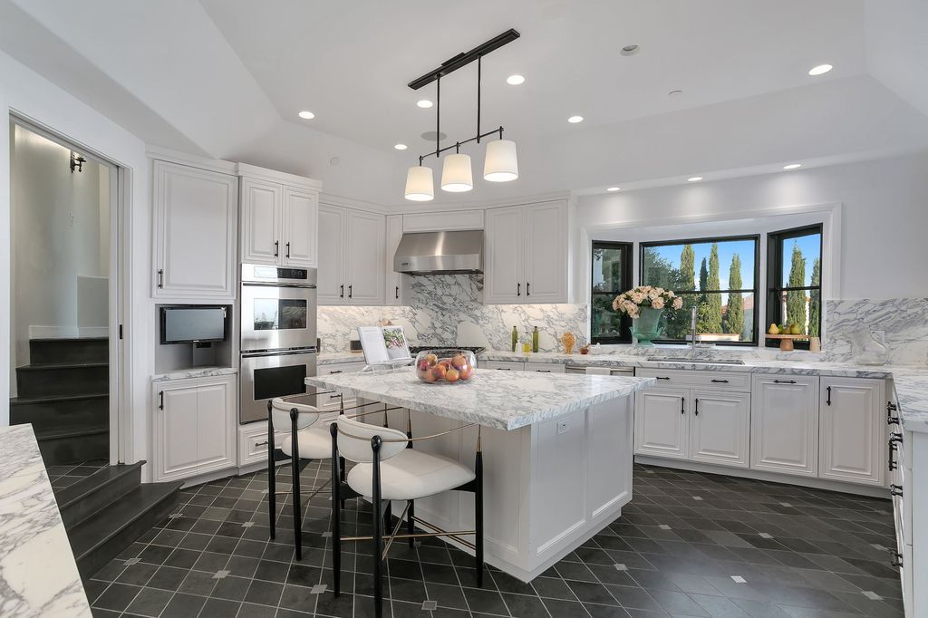 The Villa in Los Angeles is a newly built compound with separate guest house and pool bath perfect for for entertaining now available for sale. This home located at 9368 Flicker Way, Los Angeles, California