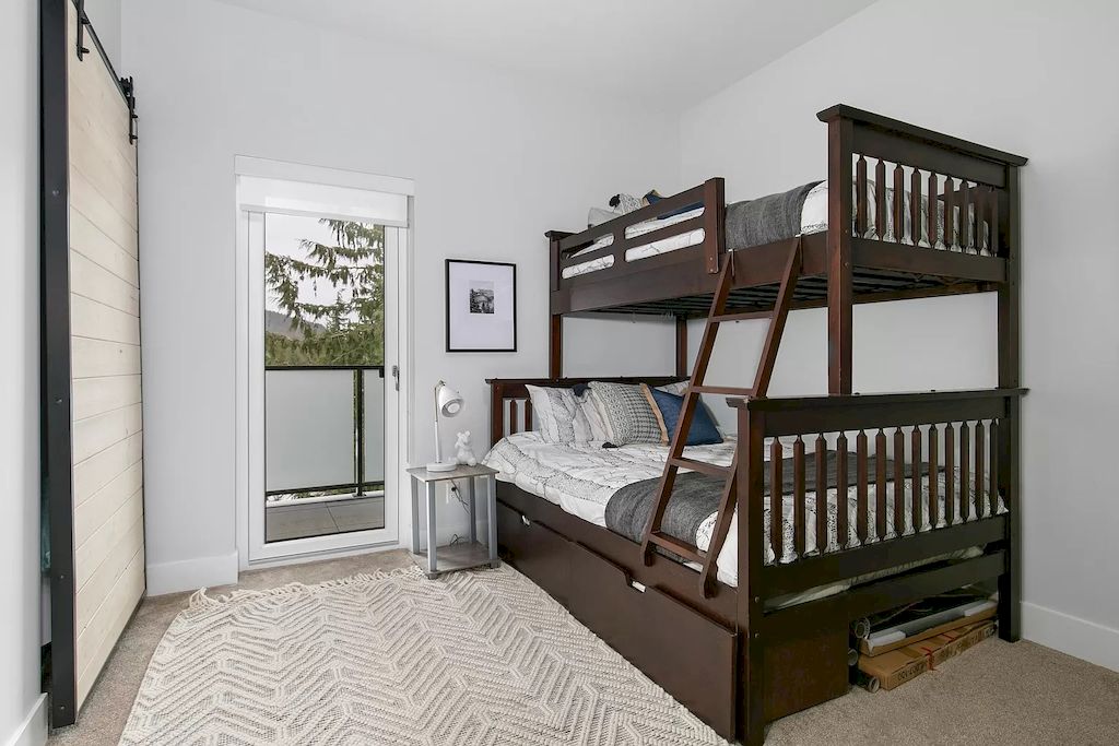 A neutral color scheme of black, white, and tans is a good choice if you want to depart from the kid-friendly bunk bed look. This studio apartment appears sophisticated and stylish.