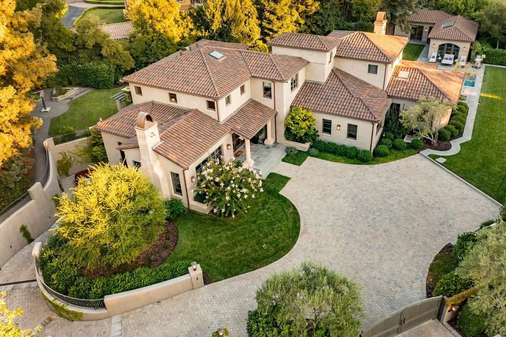 The Atherton Home is a spectacular estate set on an intimate setting built with high-end appointments and finishes now available for sale. This home located at 147 Patricia Dr, Atherton, California