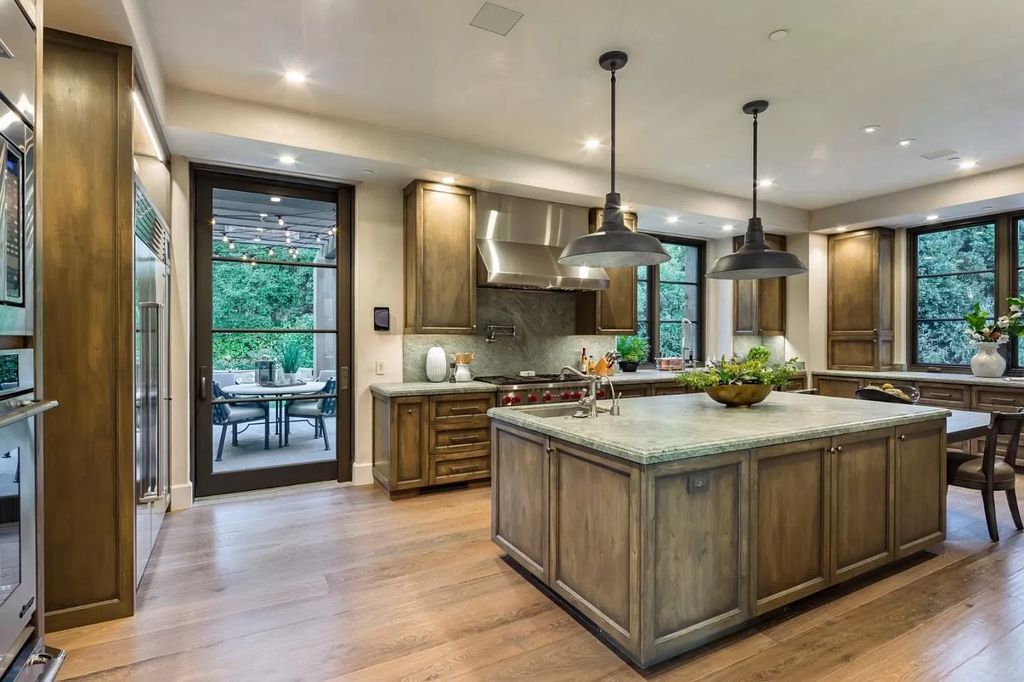 The Atherton Home is a spectacular estate set on an intimate setting built with high-end appointments and finishes now available for sale. This home located at 147 Patricia Dr, Atherton, California