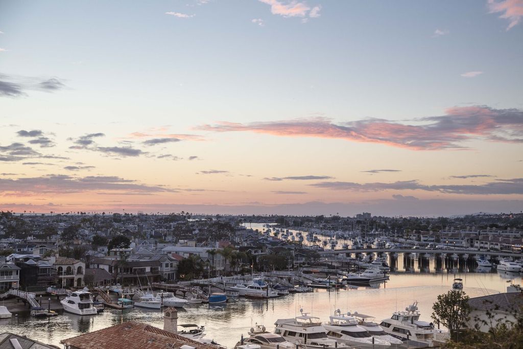 The Home in Corona Del Mar is an astounding architectural masterpiece features walls of glass overlooking Newport Harbor now available for sale. This house located at 1523 Dolphin Ter, Corona Del Mar, California