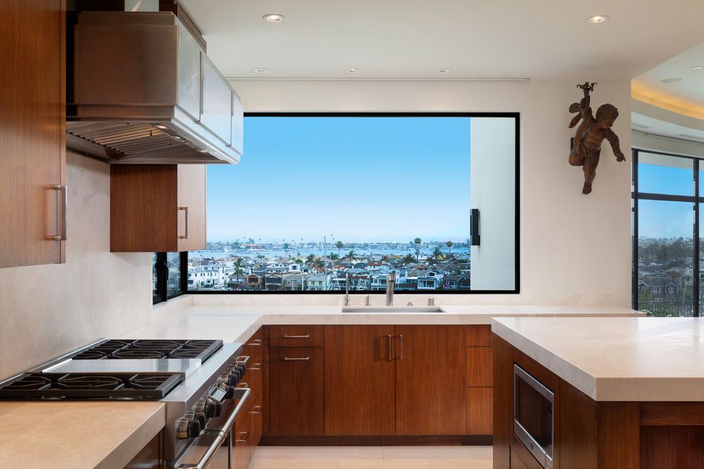 The Home in Corona Del Mar is an astounding architectural masterpiece features walls of glass overlooking Newport Harbor now available for sale. This house located at 1523 Dolphin Ter, Corona Del Mar, California